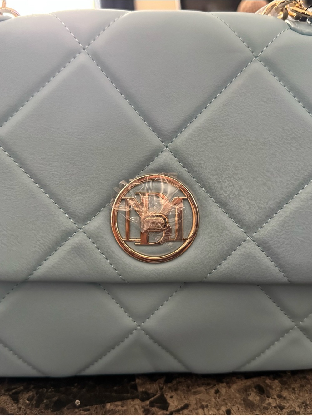 Quilted Light Blue Shoulder Bag with Gold Accent